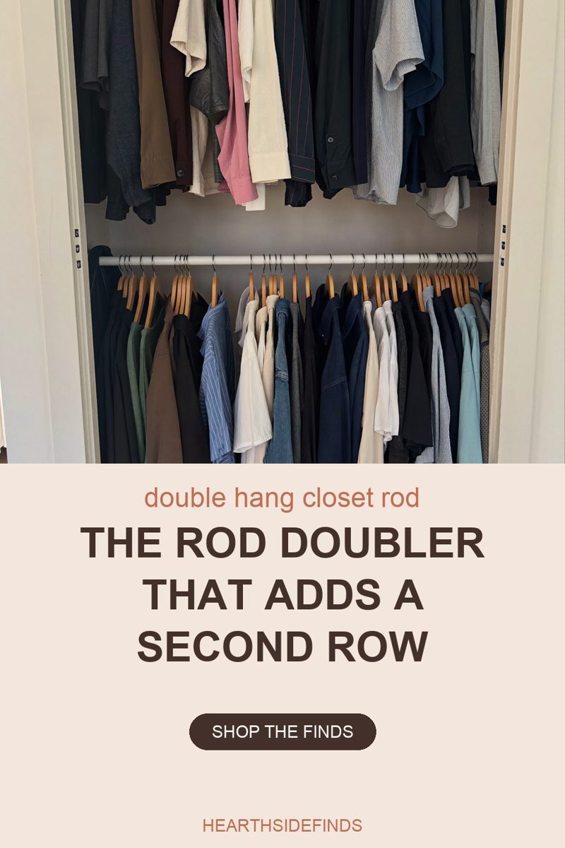 Photo looking into an open reach-in closet cropped to its two hanging rows: the hems and sleeves of shirts and jackets in brown, pink, cream and navy fill the top of the frame, and below them a white rail hangs on hooks carrying a full row of wooden hangers with striped shirts, denim, and cream and navy trousers, lit by soft daylight